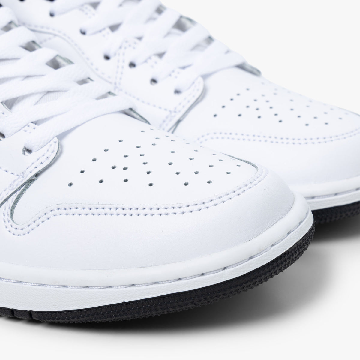 Jordan 1 Low Blanc / Noir - Blanc
