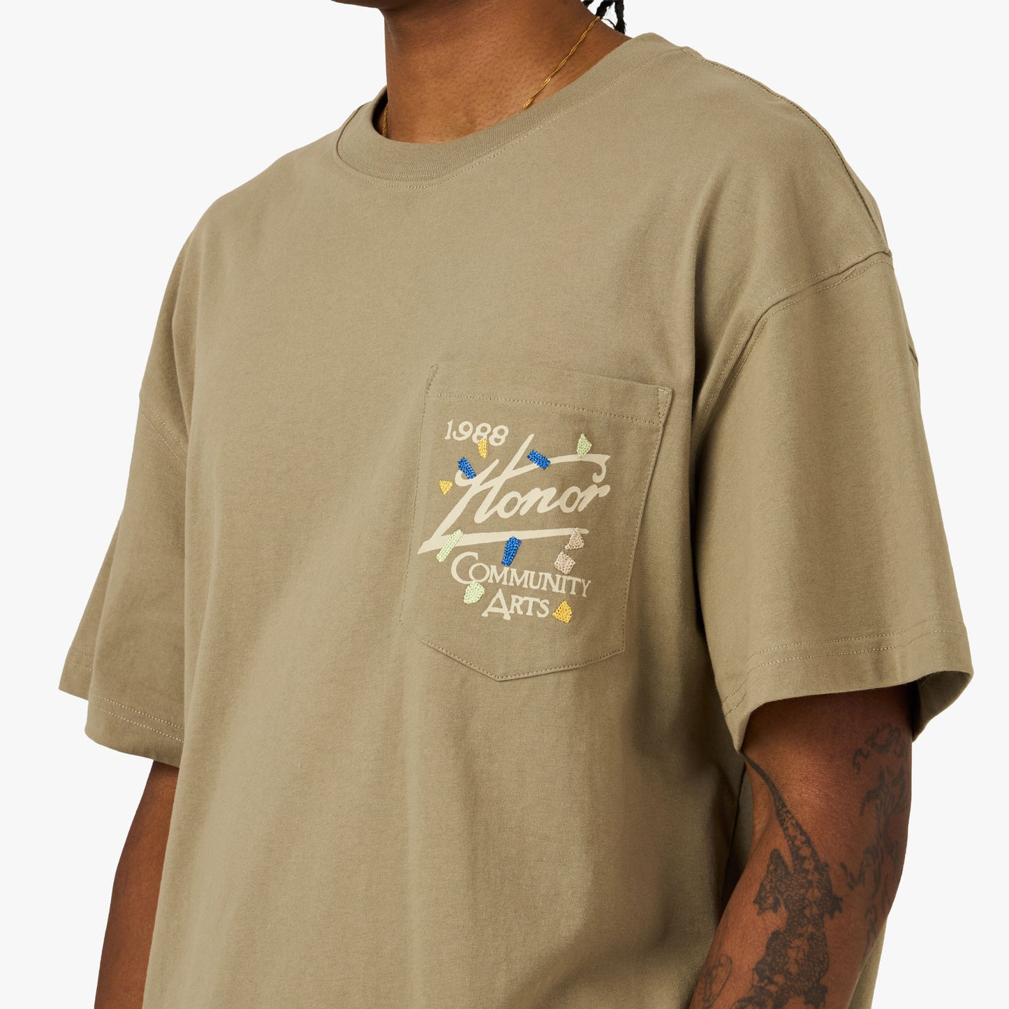 Honor The Gift Community Arts T-Shirt Pebble