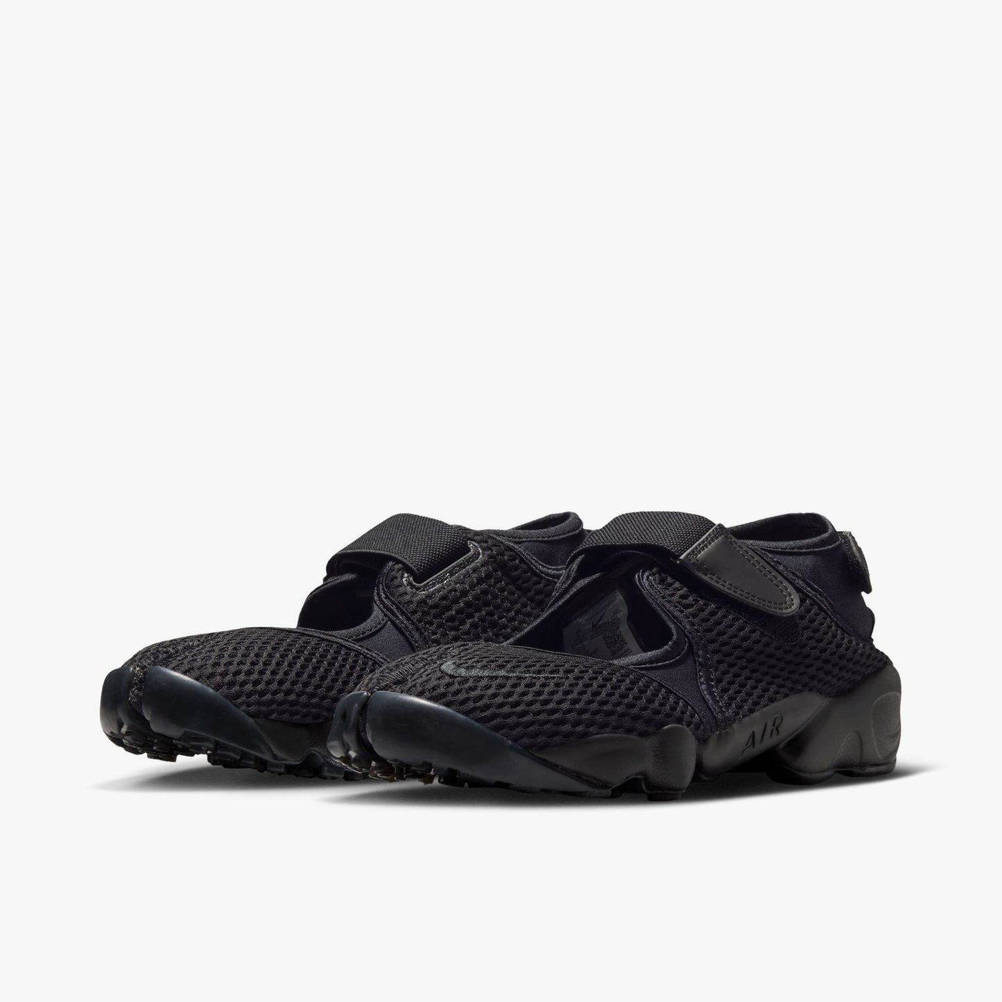 Nike Women's Air Rift Mesh. Three-quarter view of black split-toe shoes showing midfoot hook-and-loop strap and sculpted midsole with AIR written on the side.