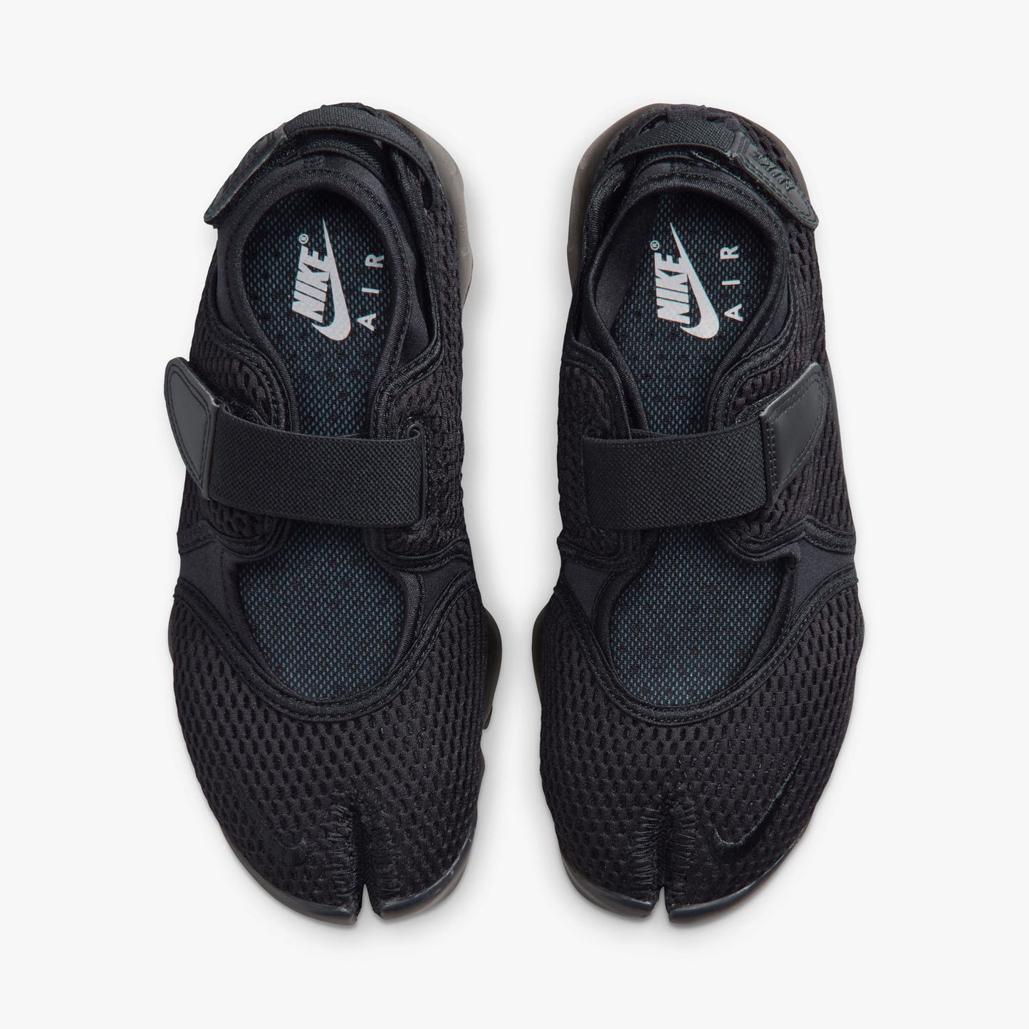 Nike Women's Air Rift Mesh. Top view of pair of black split-toe shoes showing midfoot straps, textile lining, and white Nike Air inner sole branding.