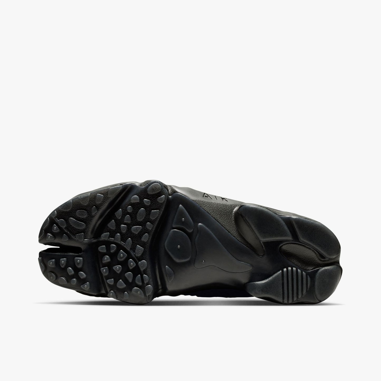 Nike Women's Air Rift Mesh. Bottom view of black split-toe shoes showing rubber traction outsole pattern and split-toe groove.