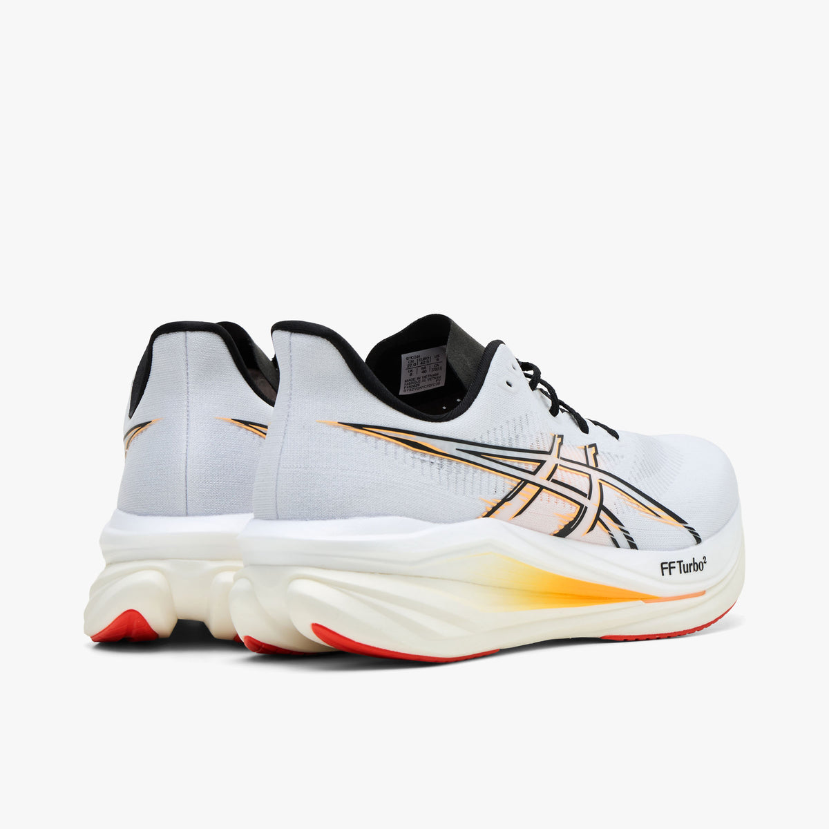 ASICS SONICBLAST 2. Rear view of a pair of running shoes displaying white heel counters with black collar rims, black padded linings, and thick white-to-orange gradient cushioned midsoles. 