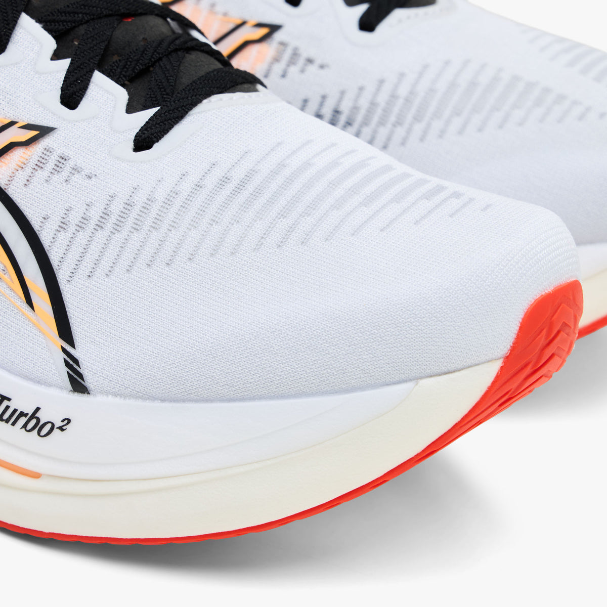 ASICS SONICBLAST 2. Close-up view of toe box highlighting breathable white engineered mesh construction, black side logo detailing, and FF Turbo branding on the thick white foam midsole rim. 