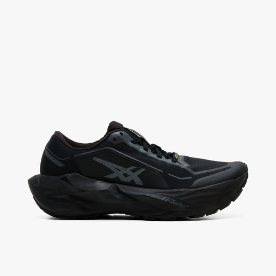ASICS NOVABLAST 6 GTX. Side view featuring black GORE-TEX waterproof mesh upper, graphite grey Tiger Stripes, sculptured thick midsole, and dark outsole. 