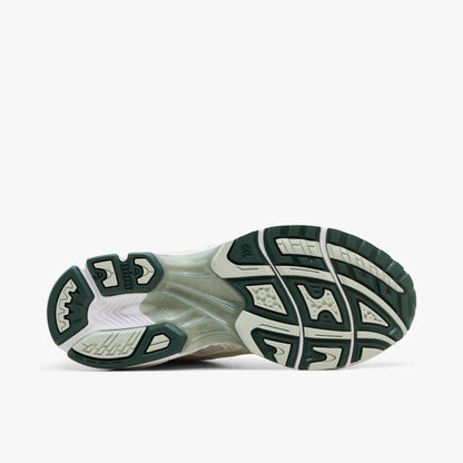 ASICS GEL-KAYANO 14. Bottom view of single shoe displaying a dark sage green rubber outsole with midfoot TRUSSTIC support system and flex grooves. 