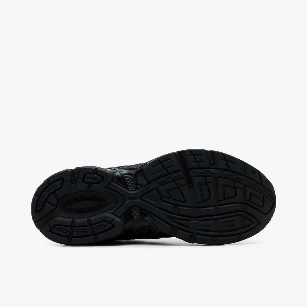 ASICS GEL-1130. Bottom view of single shoe displaying a solid black rubber outsole with TRUSSTIC support system in the midfoot and multi-surface traction pattern. 