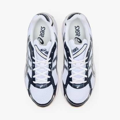ASICS GEL-1130. Top-down overhead view of a pair of sneakers displaying white mesh toe boxes, dark midnight blue overlays, white laces, padded collars, and white branded insoles. 