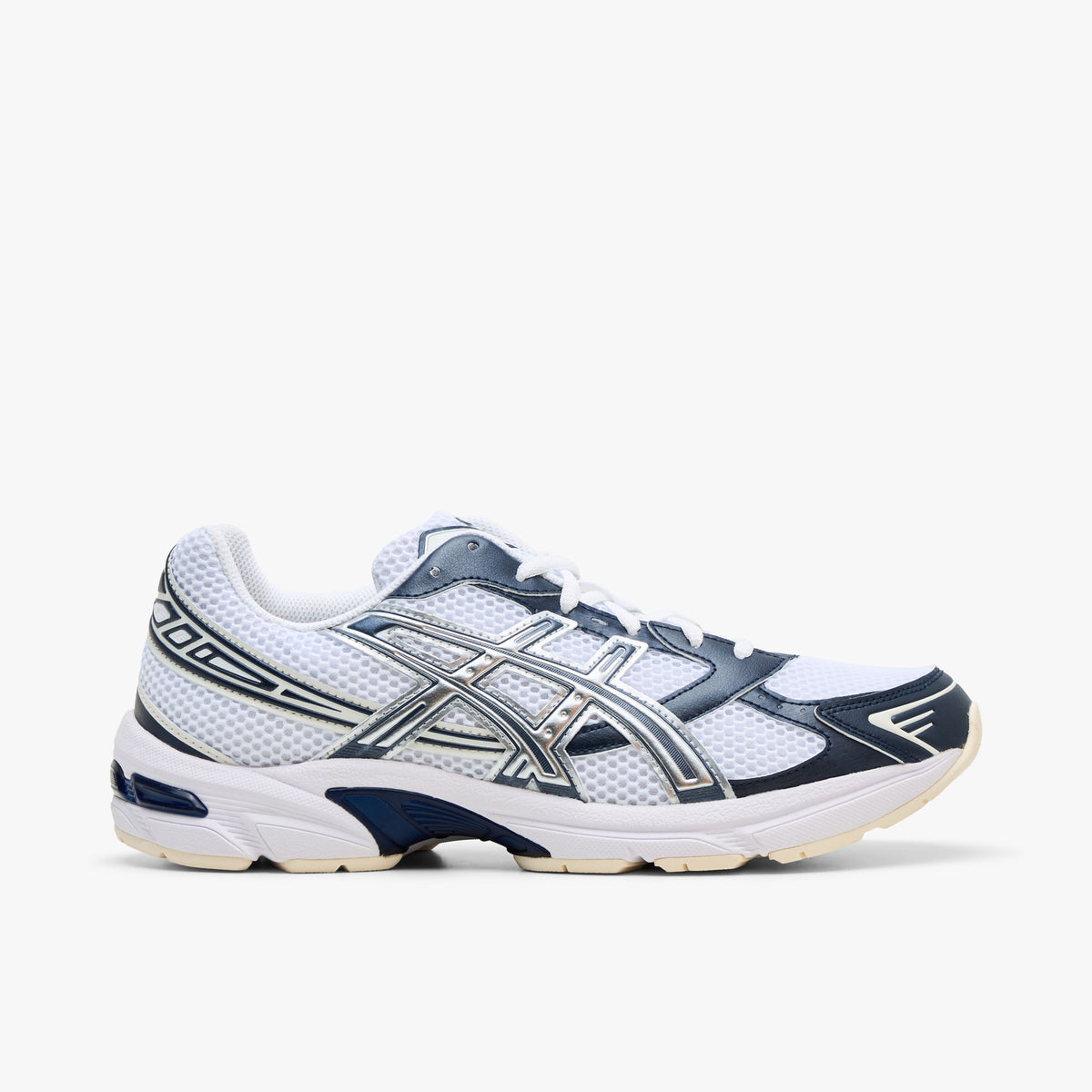 ASICS GEL-1130. Side view of retro technical running sneakers featuring a white open mesh upper, dark midnight blue synthetic overlays, metallic silver Tiger Stripes with blue accent piping, GEL-1130 branding on the lateral heel collar, off-white foam midsole with dark midnight blue shank detail, and off-white rubber outsole. 