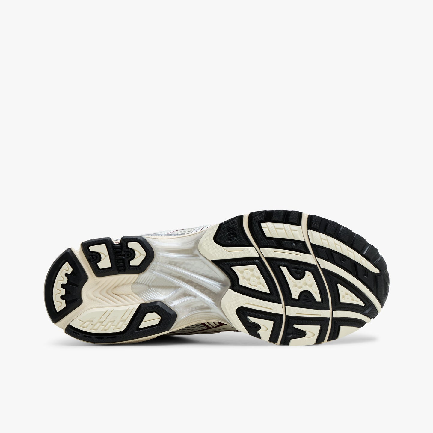 ASICS GEL-KAYANO 14. Bottom view of silver running shoes showing black and Cream rubber traction outsole pattern. 