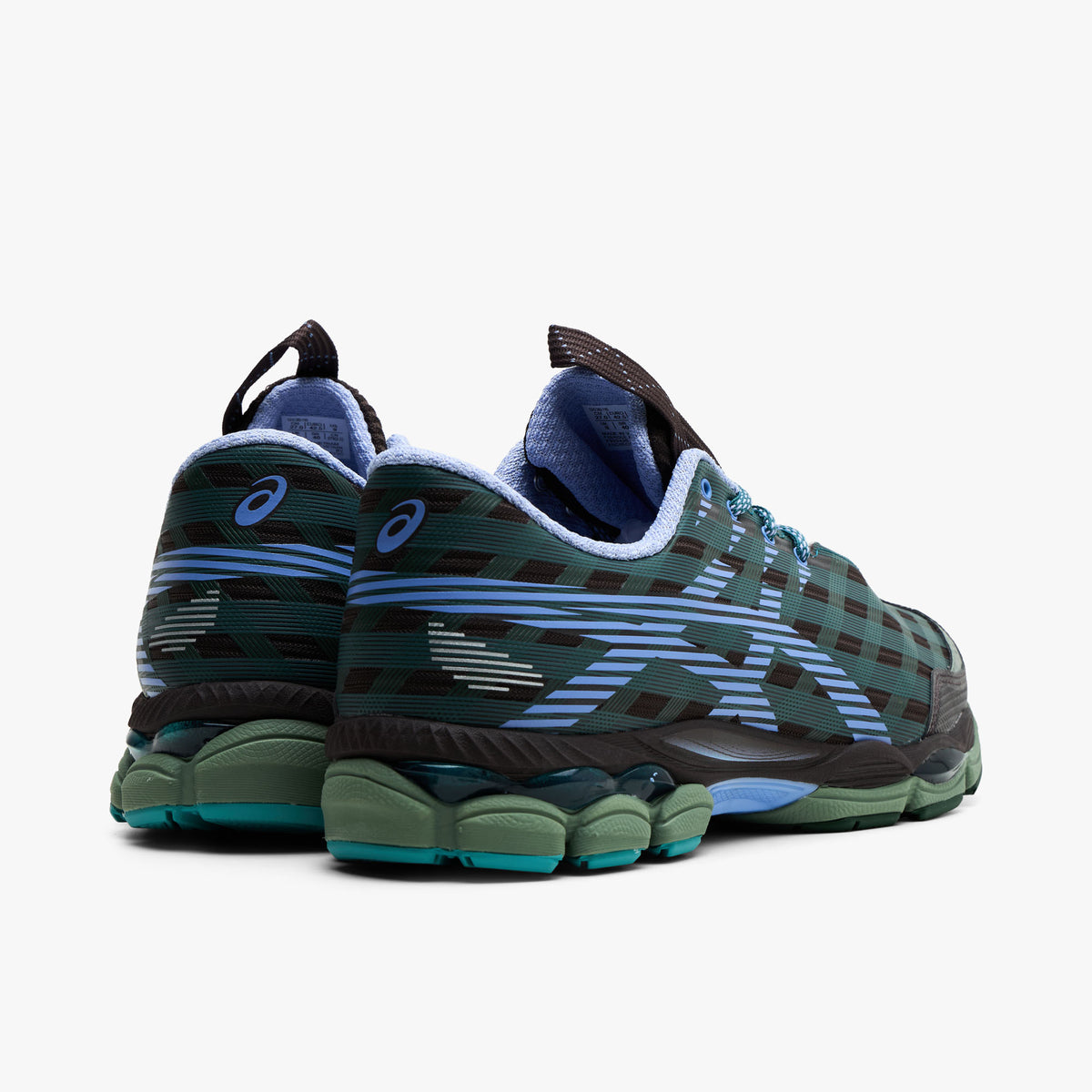 Asics US8-S GEL-SJ33. Rear three-quarter view of roasted coffee and periwinkle sneakers with layered heel panels, blue accents and green soles.