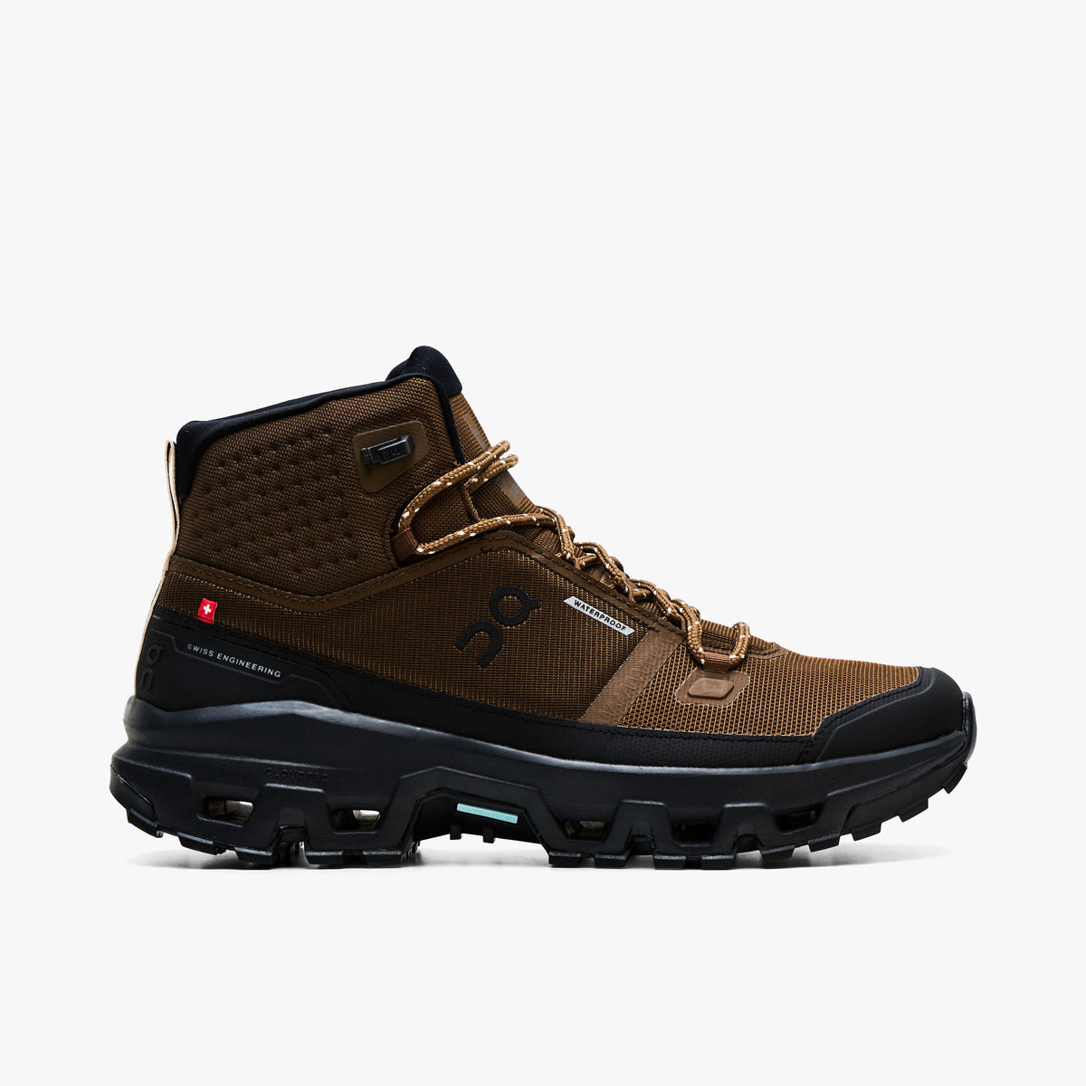 On Cloudrock Mid Waterproof. Profile view featuring earth brown technical mesh upper, mid-cut ankle collar, black protective mudguard, speed-lacing hooks, and black CloudTec trail midsole. 