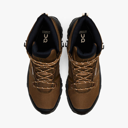 On Cloudrock Mid Waterproof. Top-down view showcasing earth brown waterproof toe boxes, speckled trail laces, black collar lining, and branded insoles. 