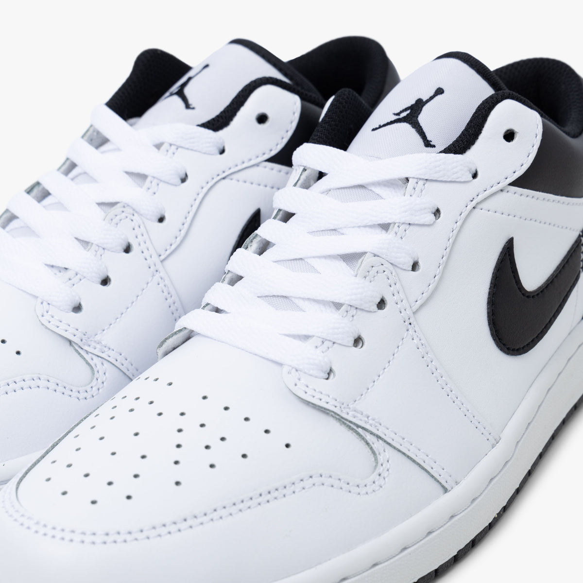 Jordan 1 Low Blanc / Noir - Blanc