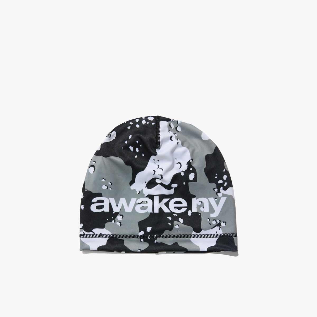 Awake NY Camo Crown Skully. Front view of a skullcap beanie featuring an all-over black, grey, and white desert camouflage pattern with white "awake ny" logo print across the front band. 