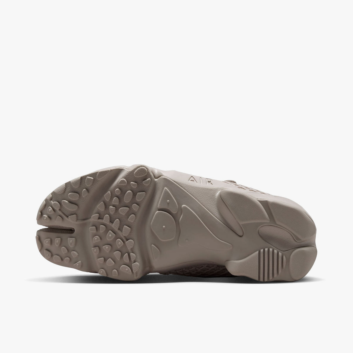 Nike Women's Air Rift. Bottom view of Cream II split-toe shoes showing rubber traction outsole pattern and split-toe groove. 