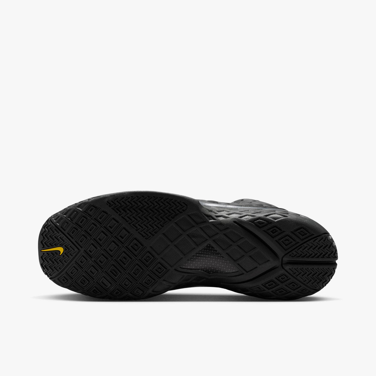 Nike Kobe III Protro. Bottom view of single shoe showing full black rubber outsole with diamond grid traction pattern and gold Kobe Sheath logo at the heel. 