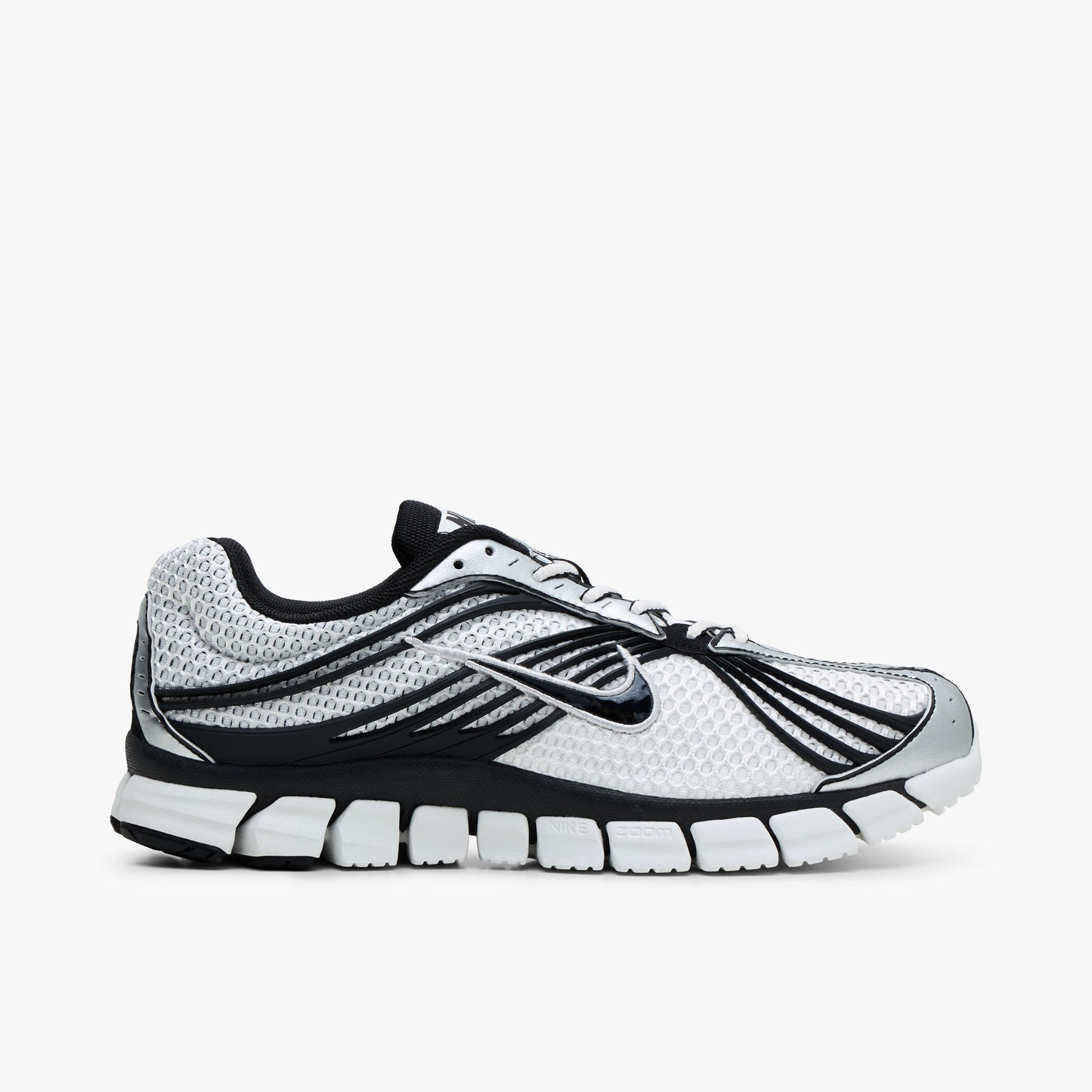 Side Nike Zoom Skylon 11. Side view of Summit White mesh running shoes with Black cage overlays, Nike Swoosh on the sidewall, and segmented midsole. 