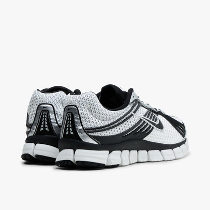 Nike Zoom Skylon 11. Rear view of Summit White and Light Smoke Grey mesh running shoes showing Black heel overlays and white segmented foam midsole. 