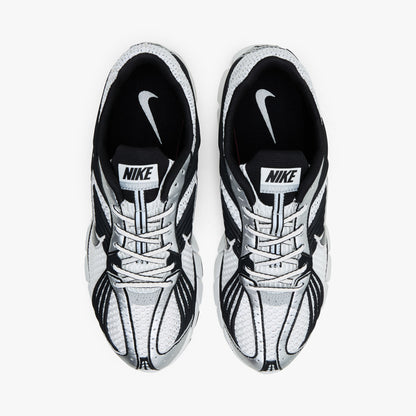 Nike Zoom Skylon 11. Top view of pair of Summit White running shoes showing Black collar lining, textile lining, white laces, and Nike tongue branding. 