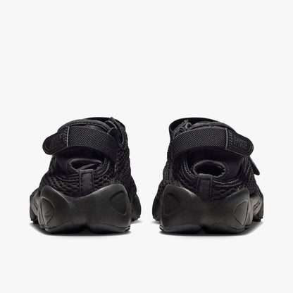 Nike Women's Air Rift Mesh. Rear view of black split-toe shoes showing adjustable heel strap closures with embroidered Nike logo hits and thick rubber midsoles. 