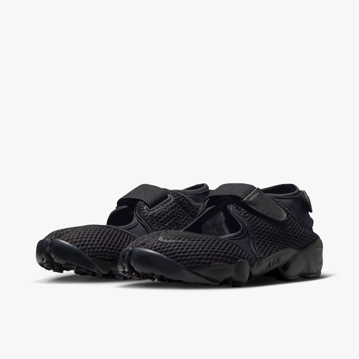 Nike Women's Air Rift Mesh. Three-quarter view of black split-toe shoes showing midfoot hook-and-loop strap and sculpted midsole with AIR written on the side. 