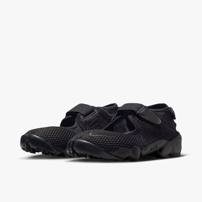 Nike Women's Air Rift Mesh. Three-quarter view of black split-toe shoes showing midfoot hook-and-loop strap and sculpted midsole with AIR written on the side. 