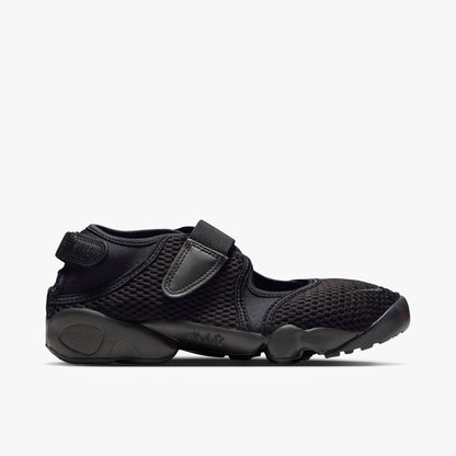 Nike Women's Air Rift Mesh. Side view of triple-black split-toe shoes with breathable mesh upper and adjustable midfoot strap.