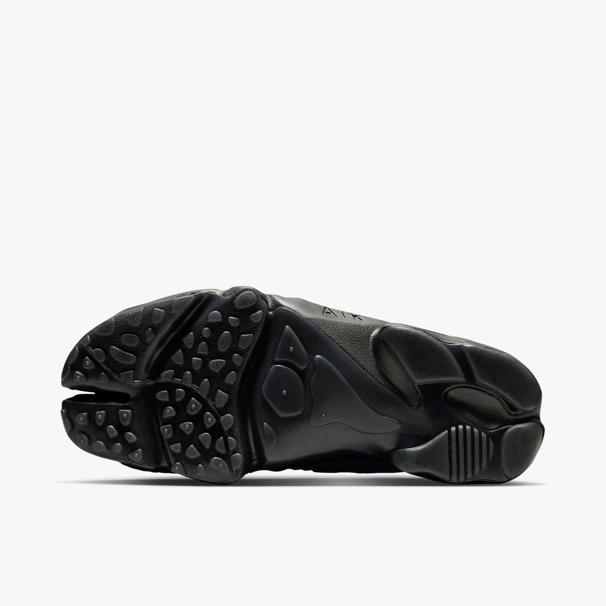 Nike Women's Air Rift Mesh. Bottom view of black split-toe shoes showing rubber traction outsole pattern and split-toe groove. 