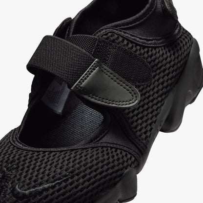Nike Women's Air Rift Mesh. Close-up of black mesh upper, split-toe box design, velcro hook-and-loop closure, and embroidered Nike Swoosh on the strap. 