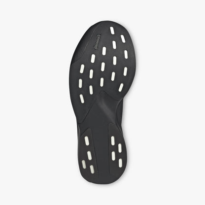 adidas adizero EVO SL Zip-Up. Bottom view of Black running shoes showing dark rubber traction outsole with white foam cutouts. 