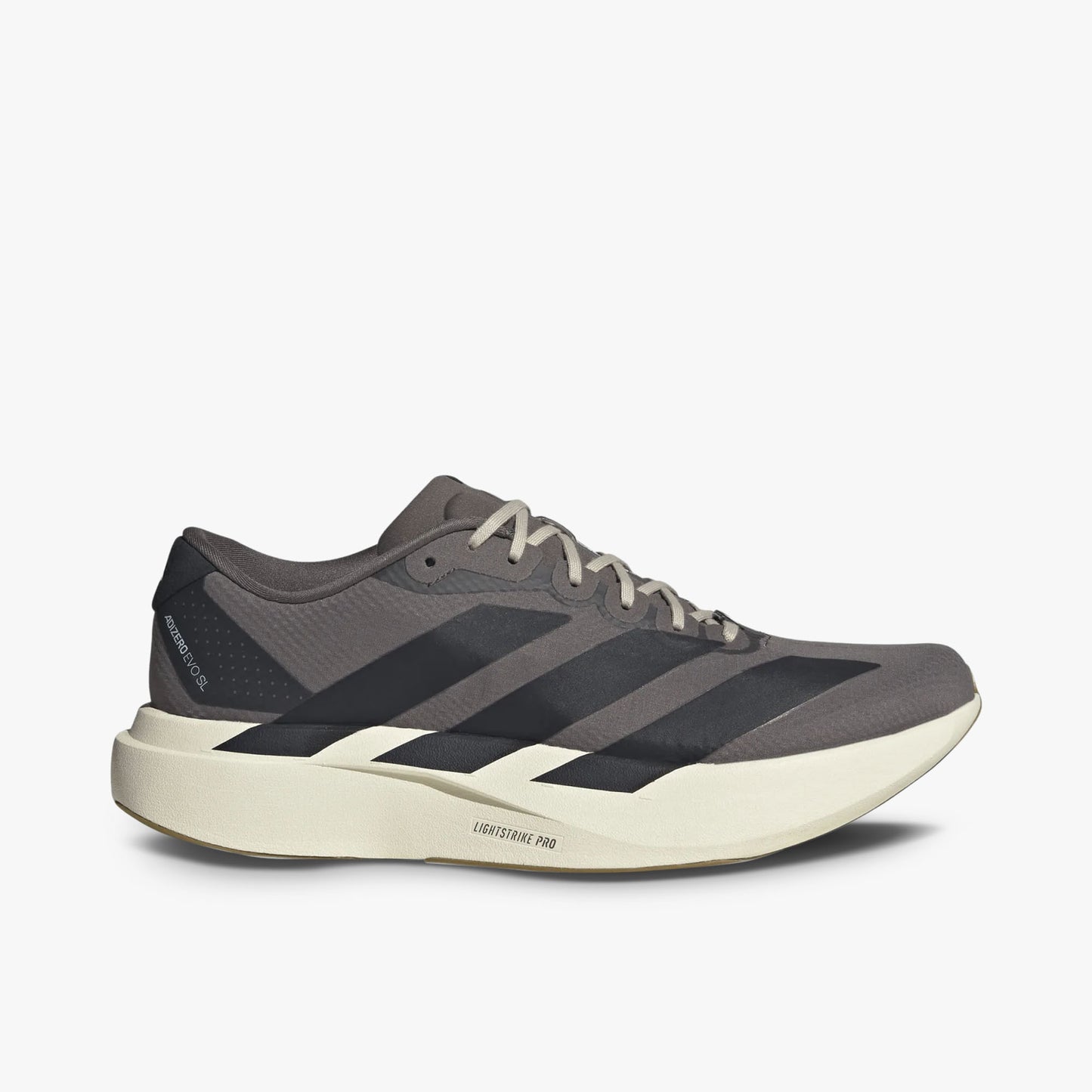 adidas adizero EVO SL. Side view of Charcoal running shoes Night Grey three-stripes and Lightstrike Pro foam midsole. 