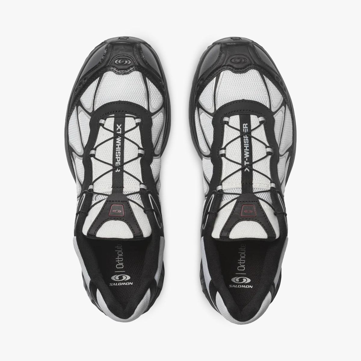 Salomon XT-WHISPER. Top-down overhead view of a pair of sneakers displaying white vamps, black overlays, black Quicklace lacing systems with lace pockets, and branded insoles. 