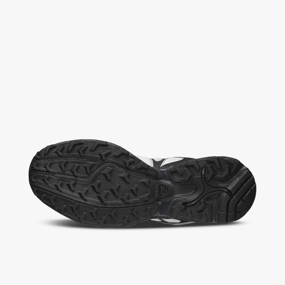 Salomon XT-WHISPER. Bottom view of single shoe displaying a black All Terrain Contagrip rubber outsole with multidirectional chevron lugs and silver midfoot chassis plate. 