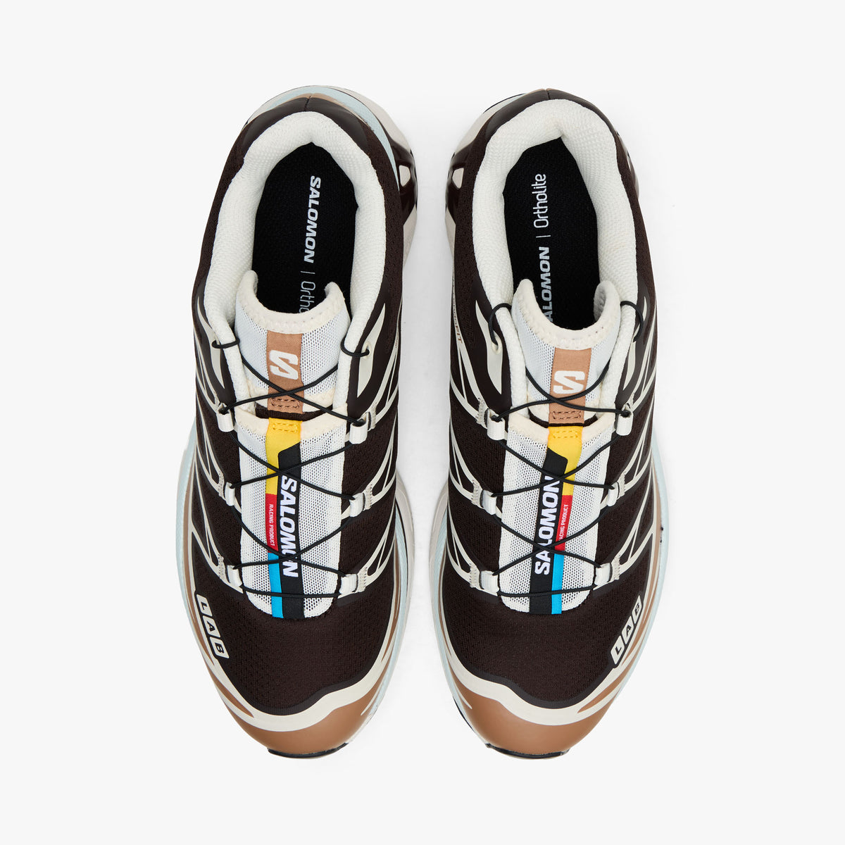 Salomon XT-6 GTX. Top view of Black Coffee coloured trail running shoes showing Quicklace system, lace shroud, and colorful tongue accent strip. 