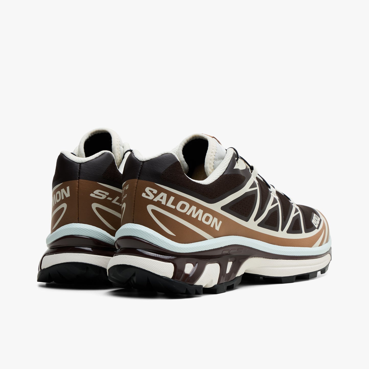 Salomon XT-6 GTX. Rear view of Black Coffee coloured trail running shoes showing pops of white on the heel, Salomon branding, and light blue chassis trim. 