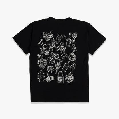 Patta Charm T-Shirt. Flat lay back view showing the black shortsleeve t-shirt with a large white graphic art print on the back featuring a collage of various charm and tattoo-style illustrations, ribbed collar, and shortsleeves. 