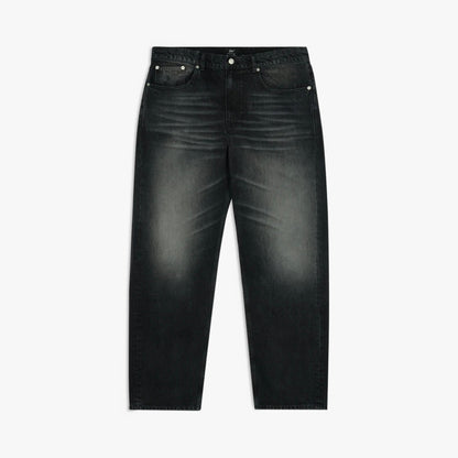 Patta Dark Dirty Whiskers Baggy Denim Pants. Flat lay front view of black denim pants featuring a relaxed baggy fit, heavy whiskering wash along the lap and thighs, classic five-pocket construction, silver-tone rivets, belt loops, button closure, and wide straight legs. 