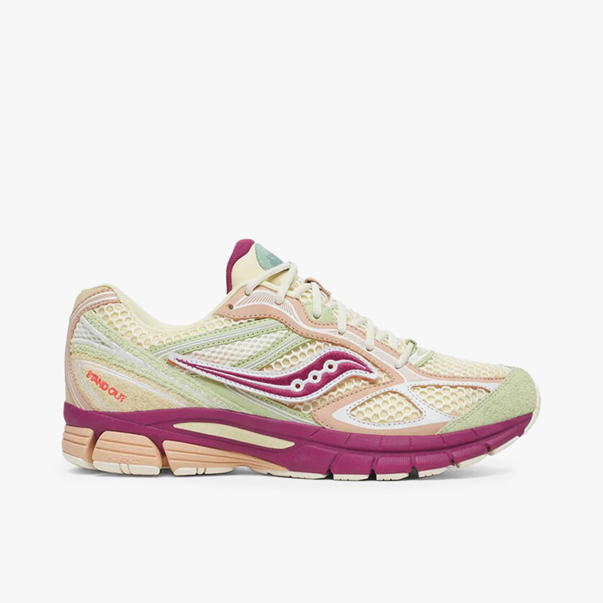 Saucony x Stan Birch Guide 7. Side view of cream open-mesh running shoes featuring sage green suede toe overlays, mauve side river logo with white dot accents, light peach wavy synthetic overlays, cream laces, and a multi-density foam midsole in mauve and cream. 