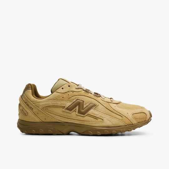 New Balance 204L. Side view of quicksand and bark sneaker with layered suede panels, tonal N logo and brown sculpted sole.