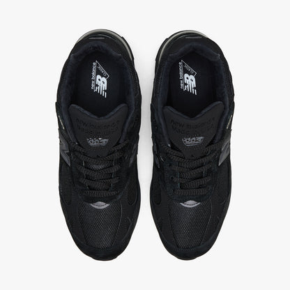 New Balance Made In USA 993. Top-down view showcasing all-black mesh toe boxes, matching lacing layout, padded collar lining, and branded insoles. 