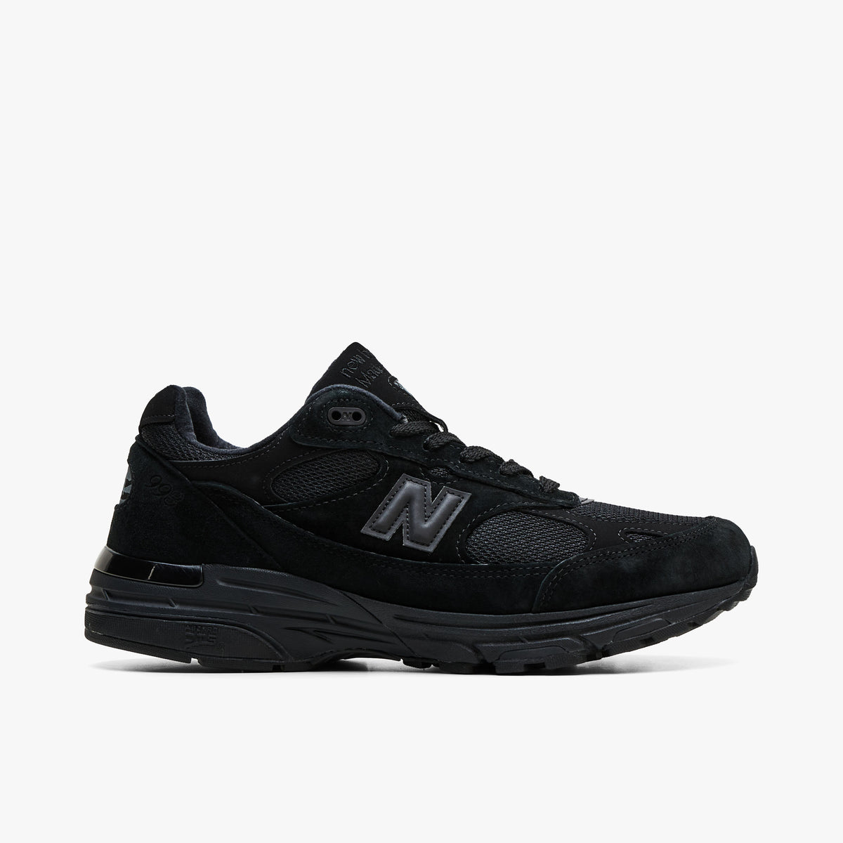 New Balance Made In USA 993. Profile view featuring all-black suede and mesh upper, tonal black 'N' logo, and cushioned ABZORB DTS midsole. 