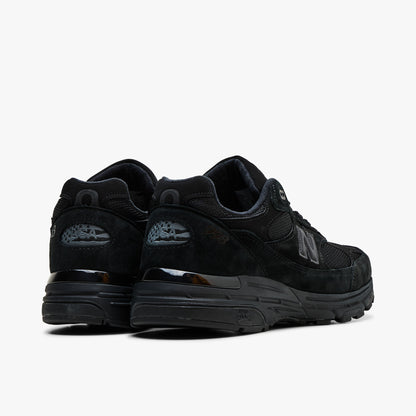 New Balance USA 993. Rear view displaying black suede heel counters, reflective 993 heel badges, and supportive ABZORB heel cushioning. 